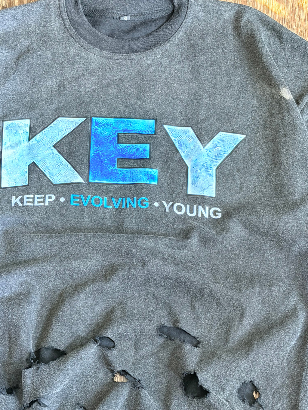 Black Keep • evolving • young tee